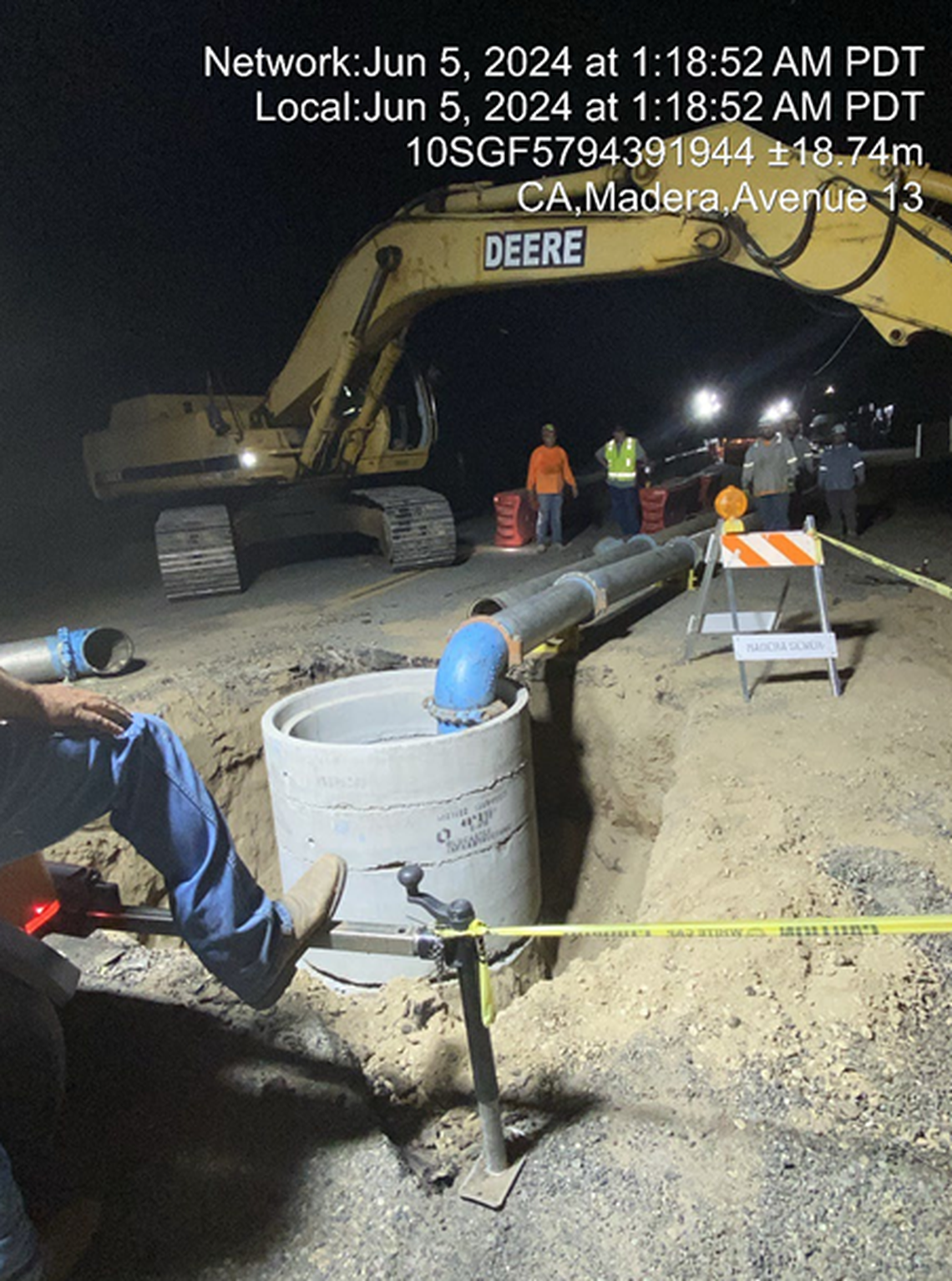 Crews work overnight to install pumps that will allow sewage to bypass a collapsed sewer line in Madera on June 5, 2024.