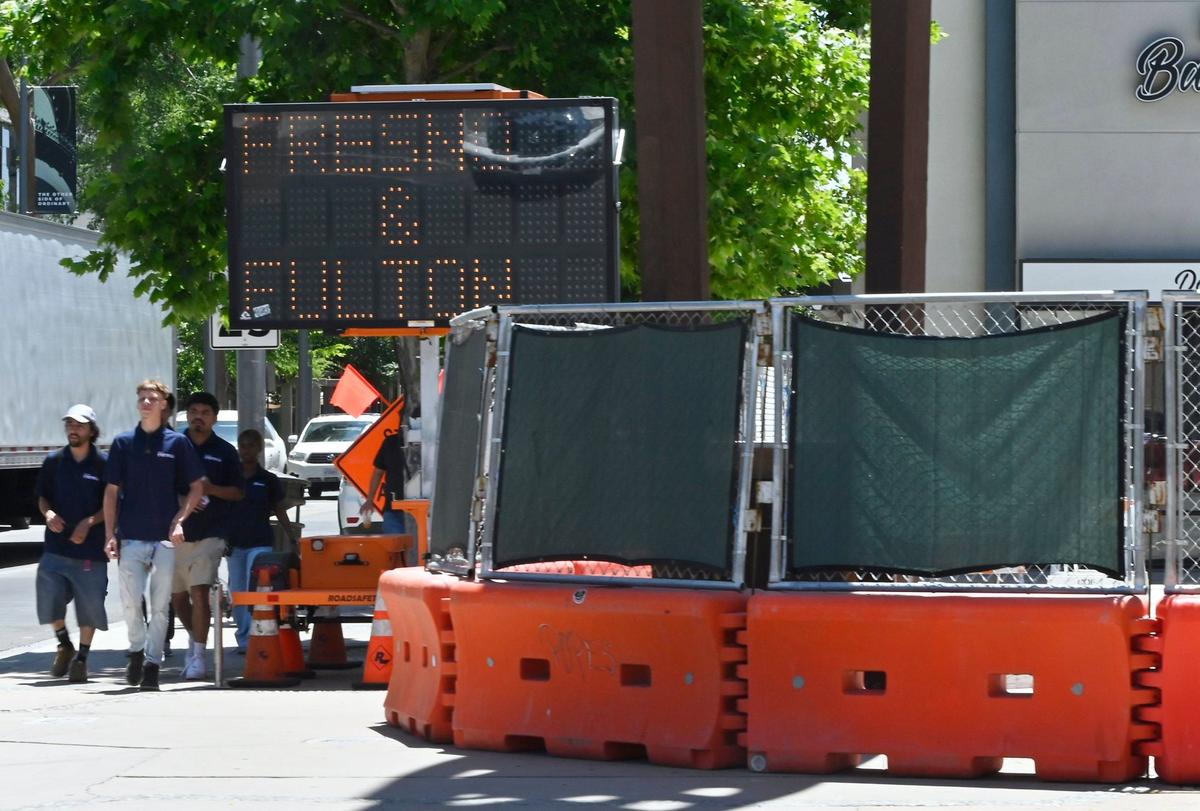Barricades block off a construction zone to the right at the plaza on Fulton and Mariposa Streets Thursday, June 20, 2024 in Fresno.