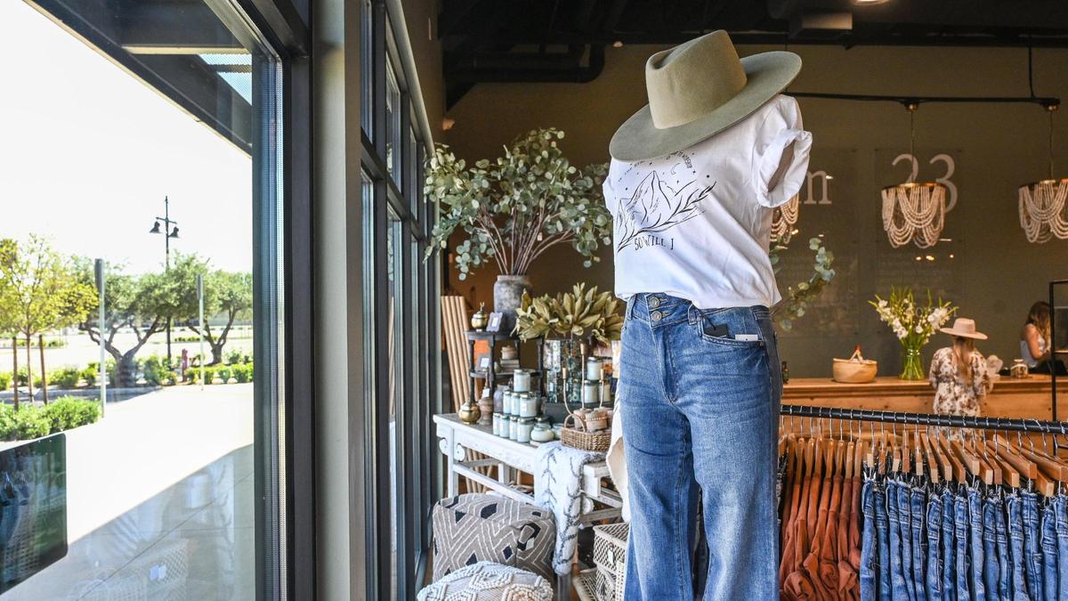 Clothing is displayed at Revival 23, the first business to open up at The Row at Heritage Grove shopping center at Shepherd and Willow in Clovis, on Thursday, April 7, 2022.