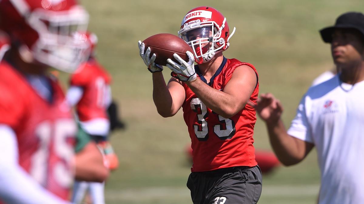 Fresno State running back Josh Hokit, center, makes a catch during the Bulldogs first fall camp practice Friday, Aug. 3, 2018 in Fresno.