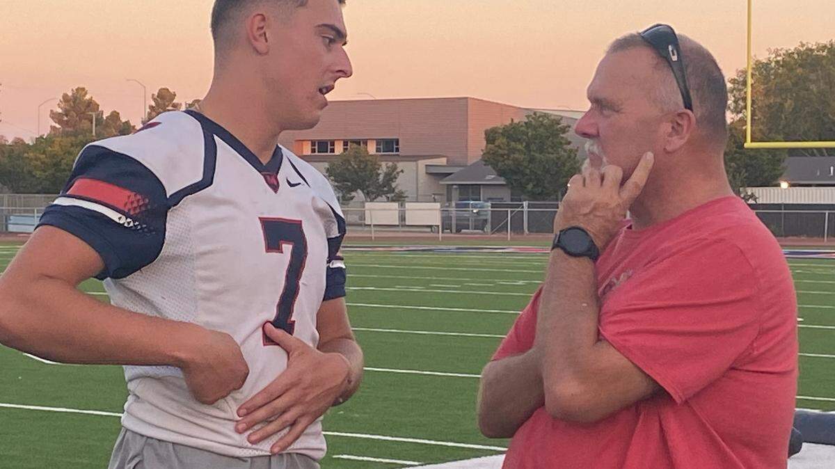 Alex Asparuhov talks to San Joaquin Memorial coach Rich Tuman.