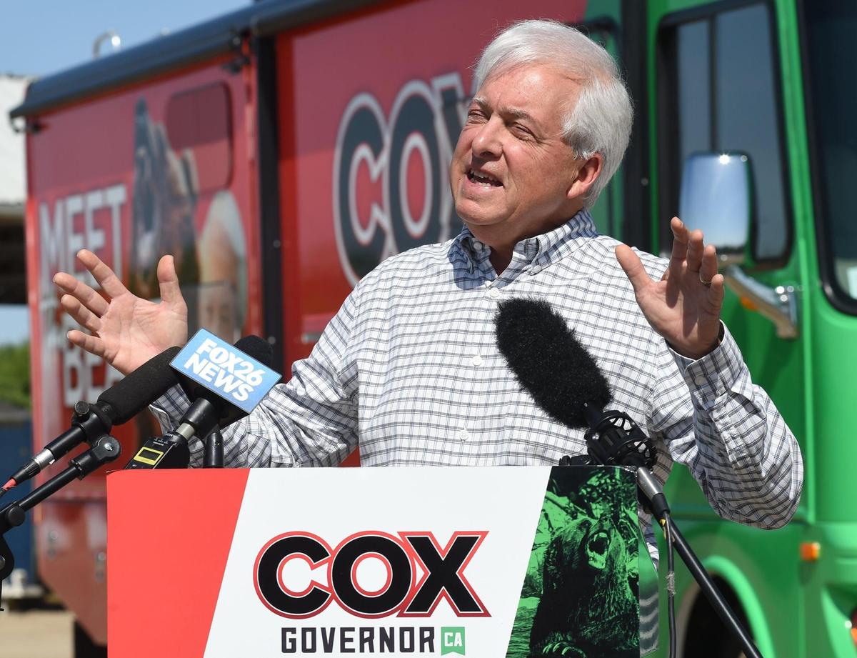 John Cox, GOP governor recall candidate, on his “Meet the Beast Bus Tour” campaign in Fresno County, on a farm southwest of Fresno, Thursday, May 6,2021,