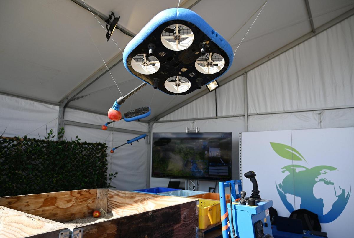 An apple-picking drone is displayed at the Tevel booth at the World Ag Expo in Tulare on Tuesday, Feb. 8, 2022.