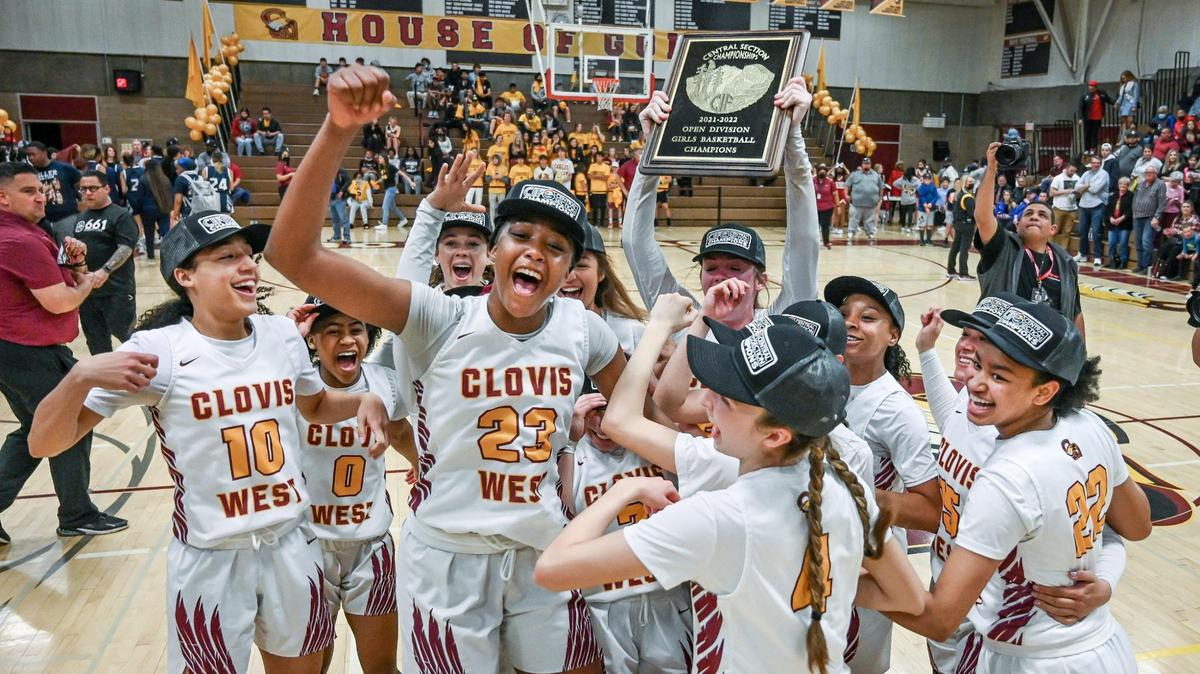 Clovis West girls basketball team members celebrate their Central Section Open Division championship after defeating Bakersfield at Clovis West on Saturday, Feb. 26, 2022.