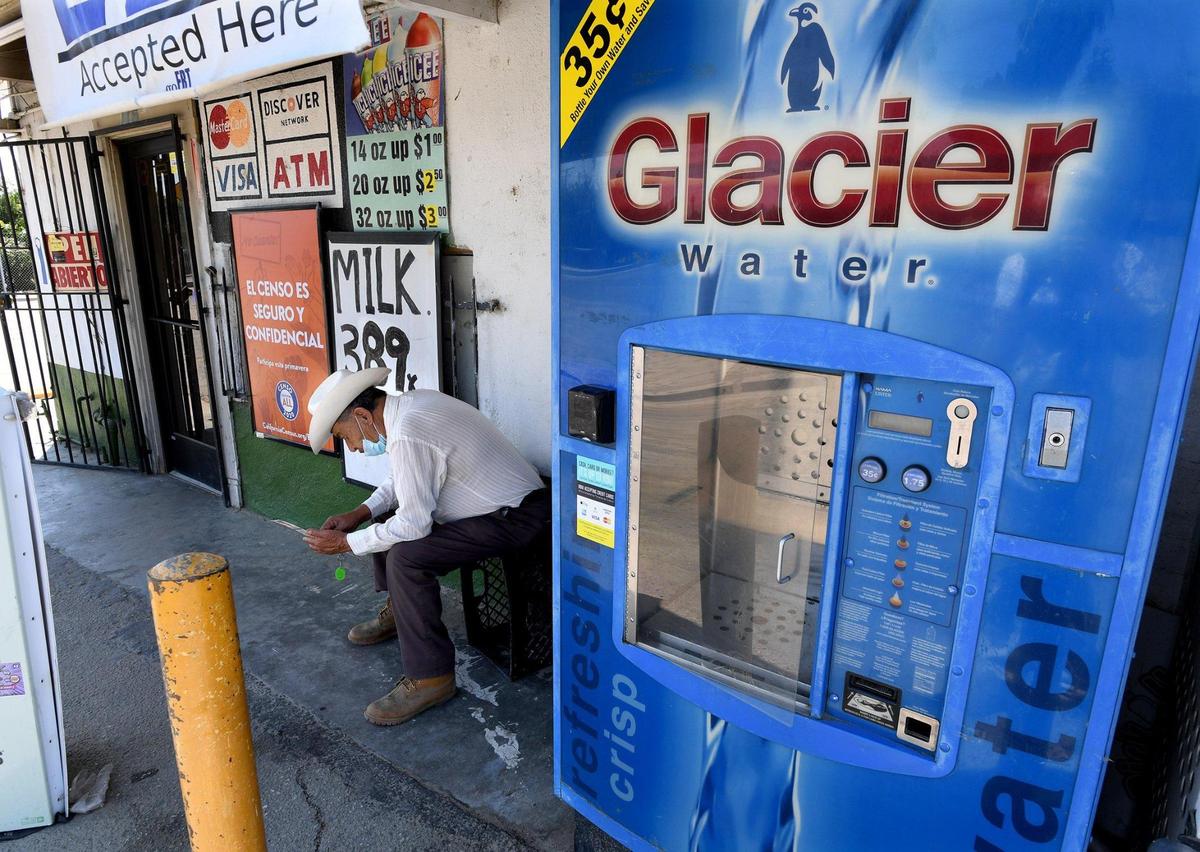 A fixture at small town grocery stores are purified water dispensing refill stations, such as this one in Earlimart. Residents there are fearful of the groundwater, even after a boil-order was recently lifted.