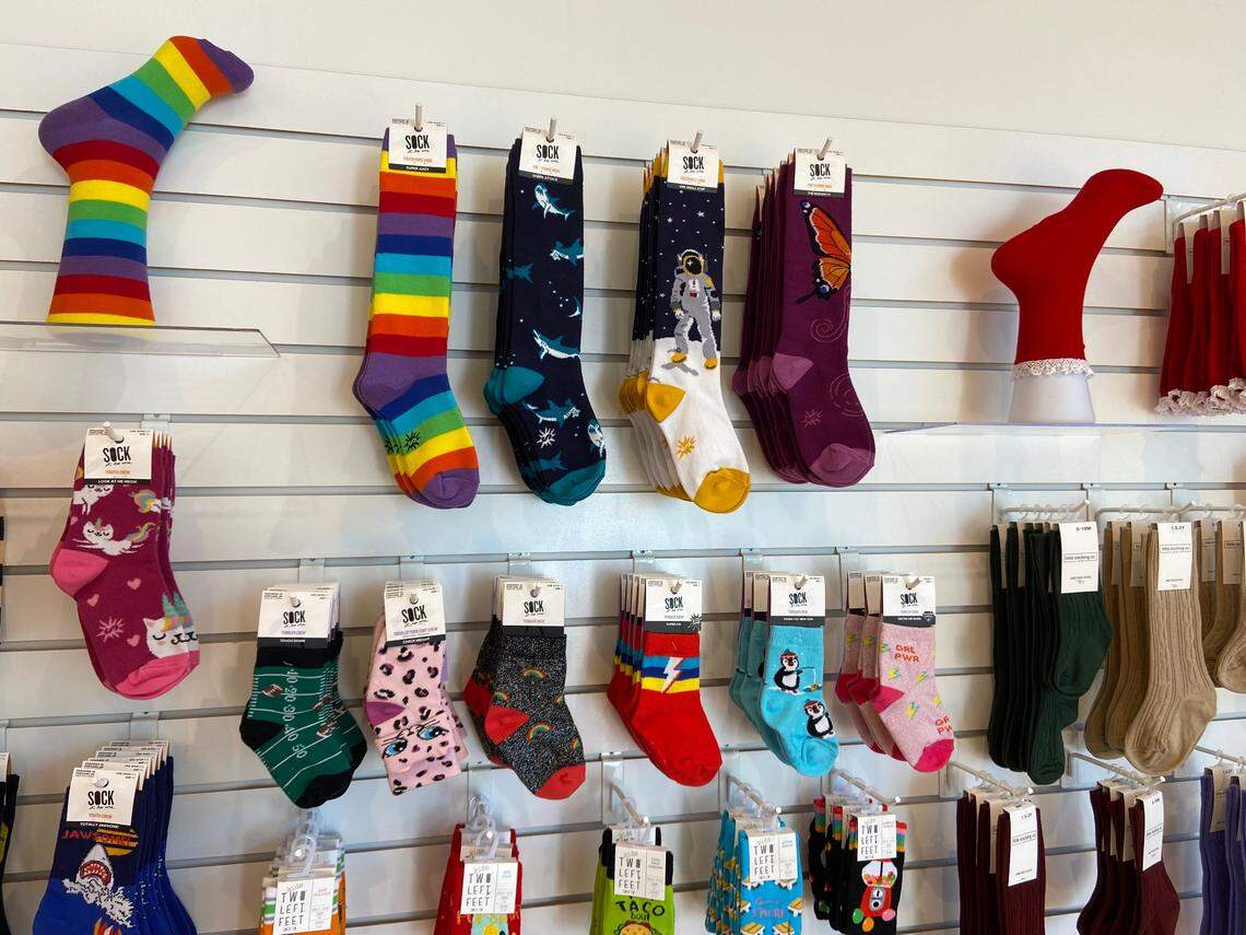 Socks featuring butterflies, dogs, rainbows, books, plants and more are for sale at the newly opened Crazy Socks in River Park.