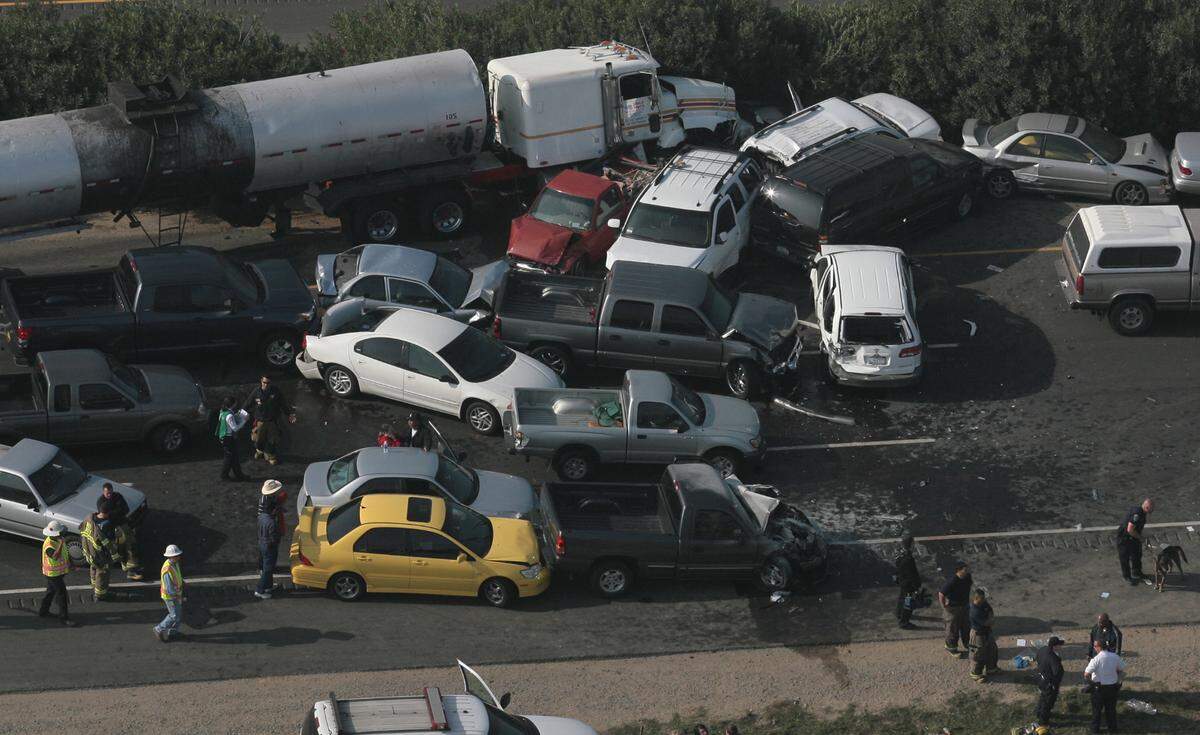 Wrecked cars and trucks from fog-related crashes are strewn across freeway 99, between Clovis and American Avenues in Fresno.