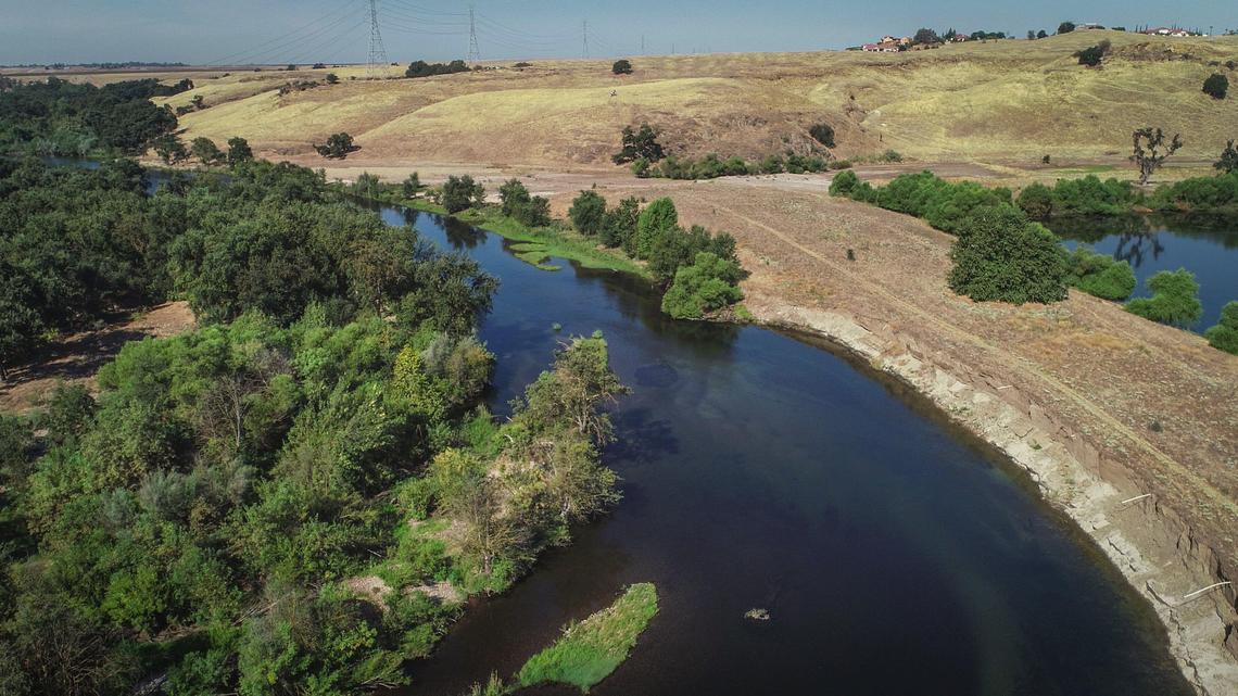 The San Joaquin River as seen in a drone image about 3 miles north of Fresno, approximate site of a potential 520-acre regional park combining two state-owned properties that belong to the San Joaquin River Conservancy.