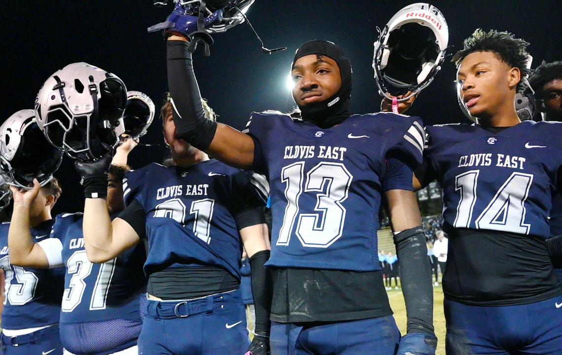 Clovis East’s Oshea Webb, second from right, celebrates with the team its 38-21 TRAC Championship win over Clovis North Friday, Nov. 1, 2024 in Clovis.