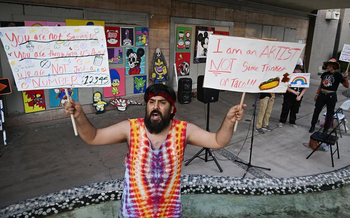 Joseph Rodriguez helps lead a small protest against the city’s decision to prohibit vendors working along the street during ArtHop Thursday, Aug. 1, 2024 in downtown Fresno.