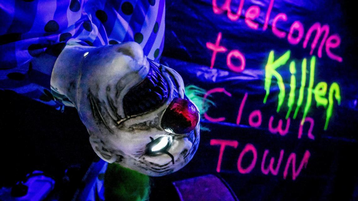 An animatronic clown head spins in circles while welcoming visitors to Killer Clown Town, one of the three maze haunts at Scare Factory in Fresno.