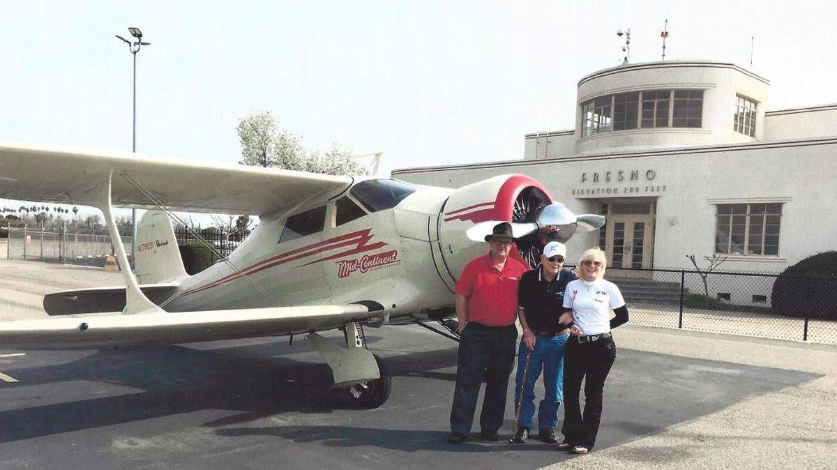 Pat Napolitano (far left) stands with World War II Col. Bud Anderson (middle) and Kelley Kreeger (right), Anderson's assistant in front of Chandler Executive Airport Terminal on April 10, 2018.