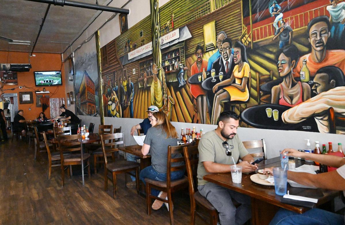 Chef Paul’s Cafe, with colorful murals inside, offers popular highly-rated soul food in Chinatown.