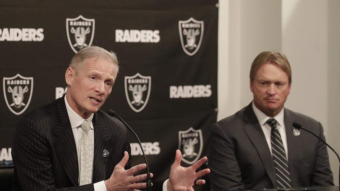 Las Vegas Raiders general manager Mike Mayock, left, and coach Jon Gruden, right, will have a busy week when free agency starts up next week. The Raiders will have $55.4 million in cap space to go after free agents.