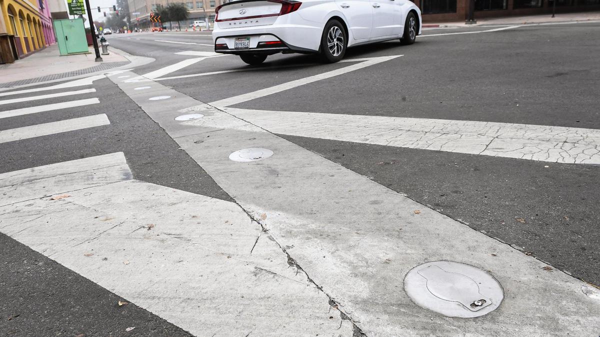 Bollard cover lids are shown on Fulton and Tulare streets in downtown Fresno. The whereabouts of the bollards, which were meant to block off street traffic for special events, are currently unknown.