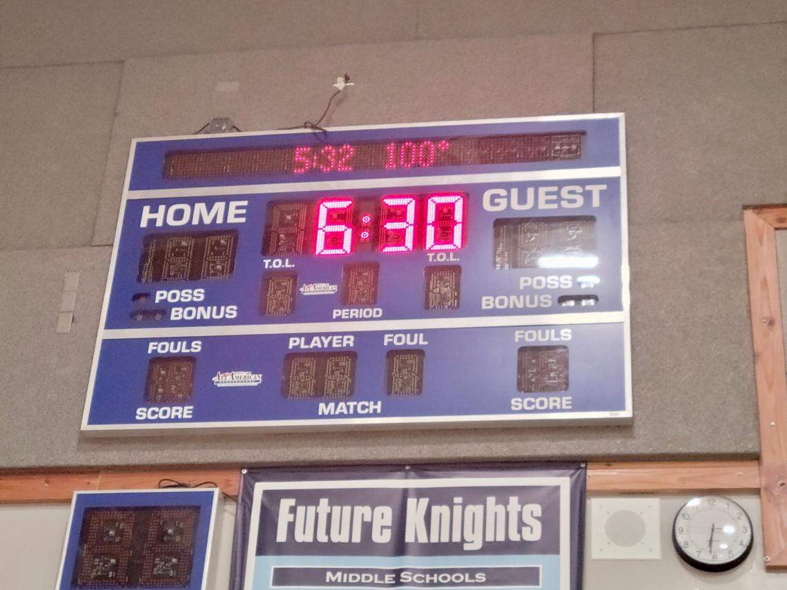The reading on the scoreboard shows 100 degrees at 6:30 p.m. on Tuesday, Aug. 15, 2023.