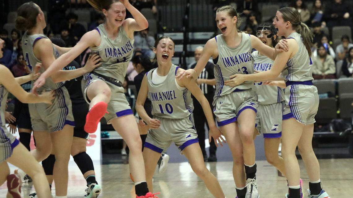 Immanuel High players celebrate their 41-29 win over Mendota High in the CIF Central Section Division IV championship game at Selland Arena on Feb. 23, 2024.
