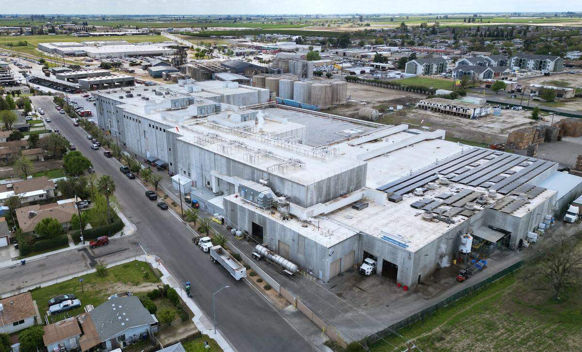 An aerial view of the main Pitman Farms facility, with private housing at the bottom left corner, photographed Thursday, April 3, 3025 near the edge of Sanger. The City of Sanger is now working with Pitman Farms in implementing new standards for water usage and treatment.