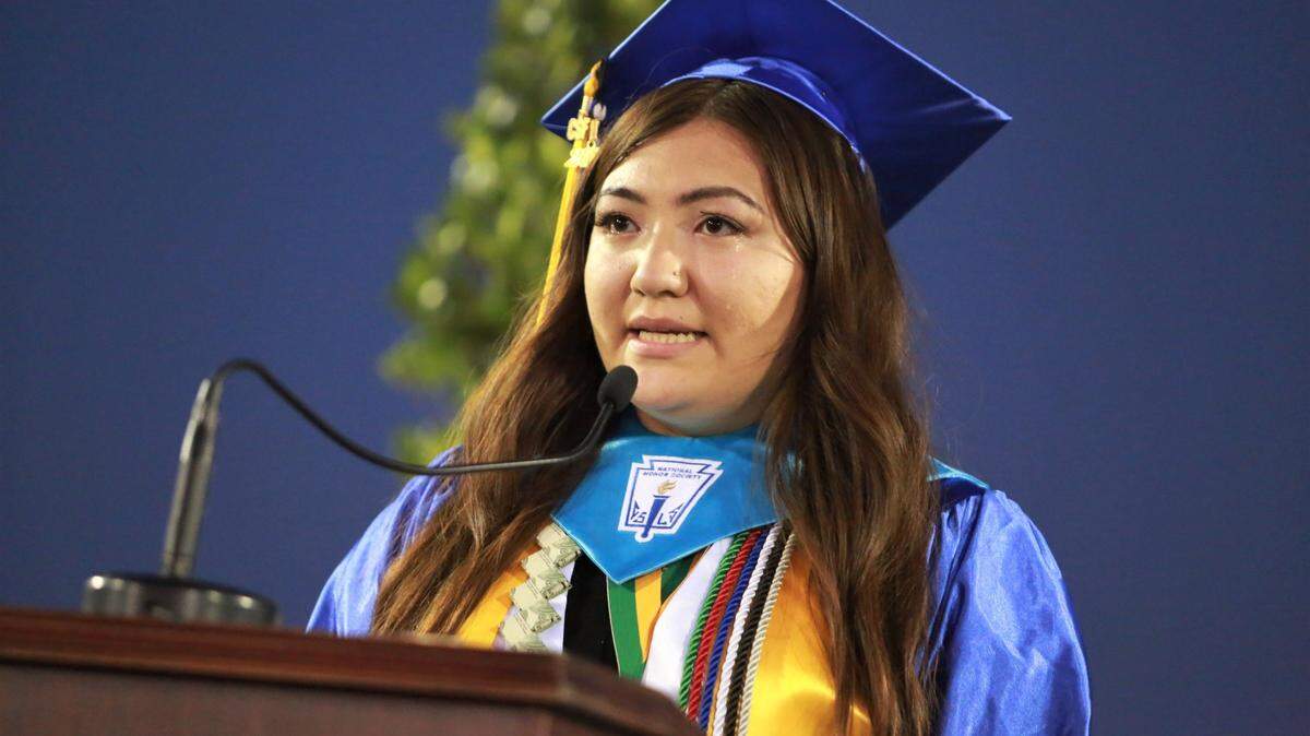 Edison Scholar Vanessa Peralta Sánchez dedicates her high school diploma to her parents.