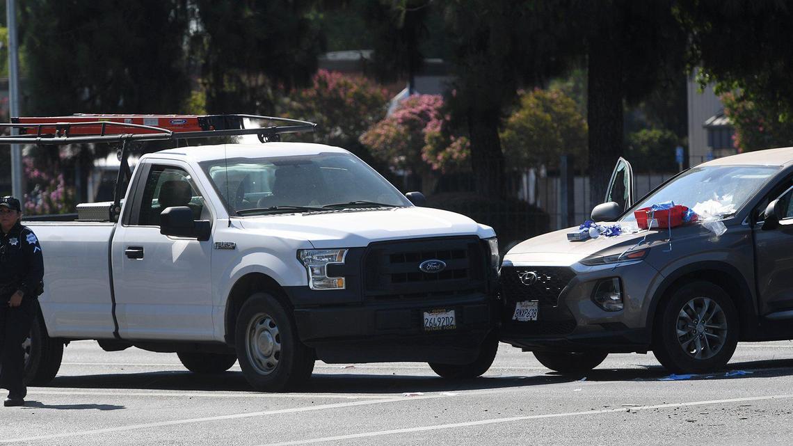 The vehicle driven by a woman critically injured by gunfire, right, collided with a work truck, at Herndon and First, Friday morning, July 9, 2021.
