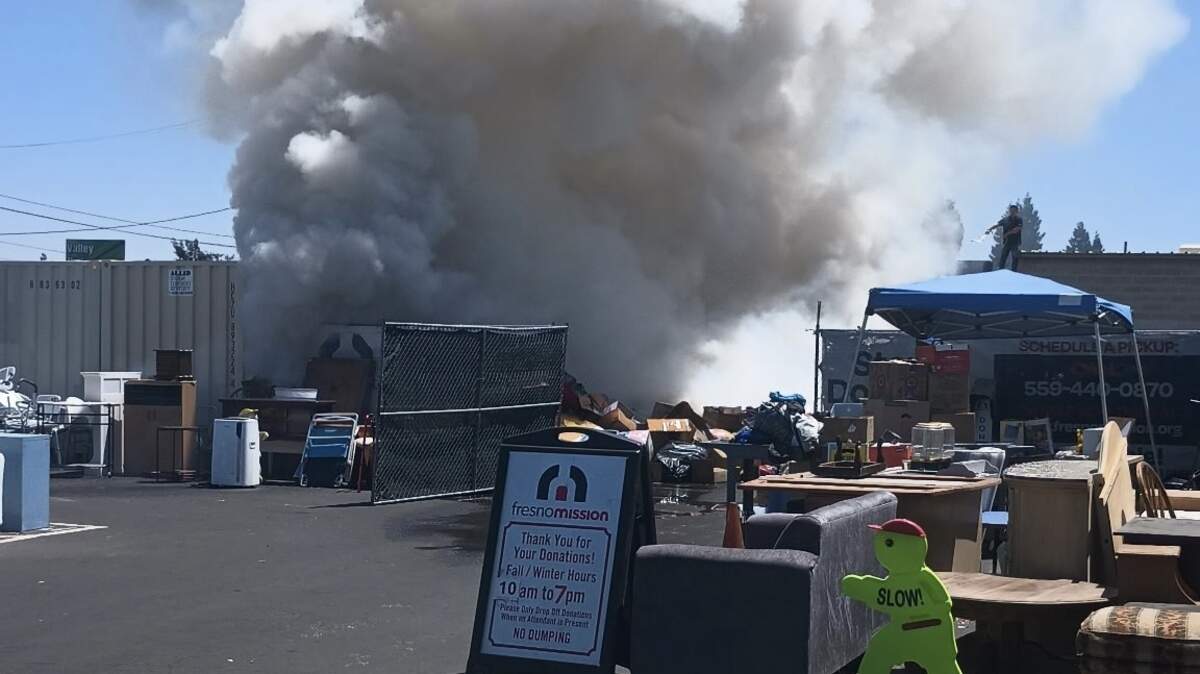 A pile of donations catch on fire in Fresno, California on Thursday, July 10, 2025.
