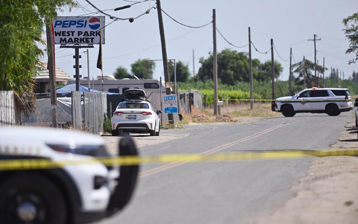 Yellow crime tape blocks South Valentine Avenue where Fresno County Sheriff’s deputies responded to a suspect lunging and chasing witnesses Monday afternoon, May 15, 2023 about 9 miles southwest of Fresno. The suspect in his late 40s or early 50s challenged deputies who later fired bean bag rounds before a deputy drew his gun and fired, striking the suspect in his leg.