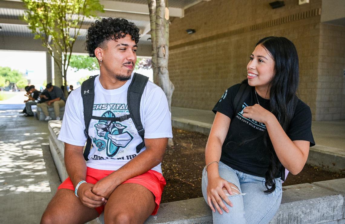 Orange Cove High School senior Isaac Angulo talks with junior Gabby Sanchez at the school on Tuesday, Aug. 20, 2024. They are both taking part in Fresno State’s Bulldog Bound program to achieve college-entry requirements for guaranteed admission to the university.