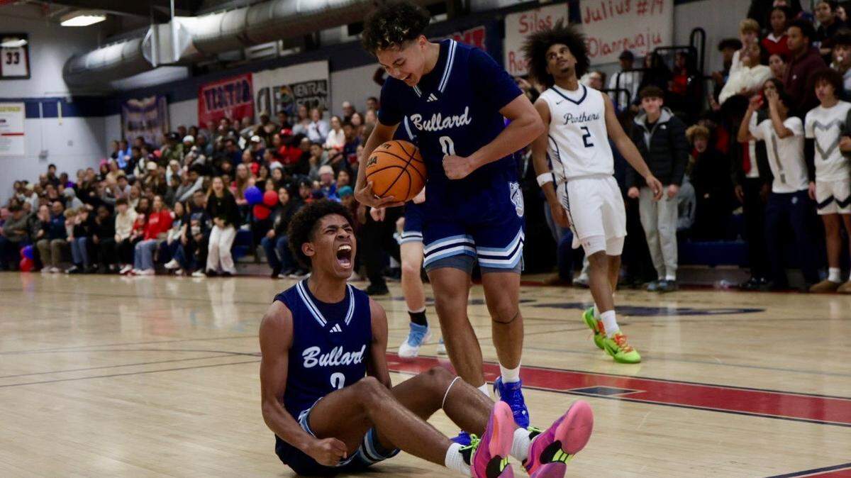 James Miranda, left, celebrates with Dalen Felder, right, in Bullard’s 86-84 victory over San Joaquin Memorial.