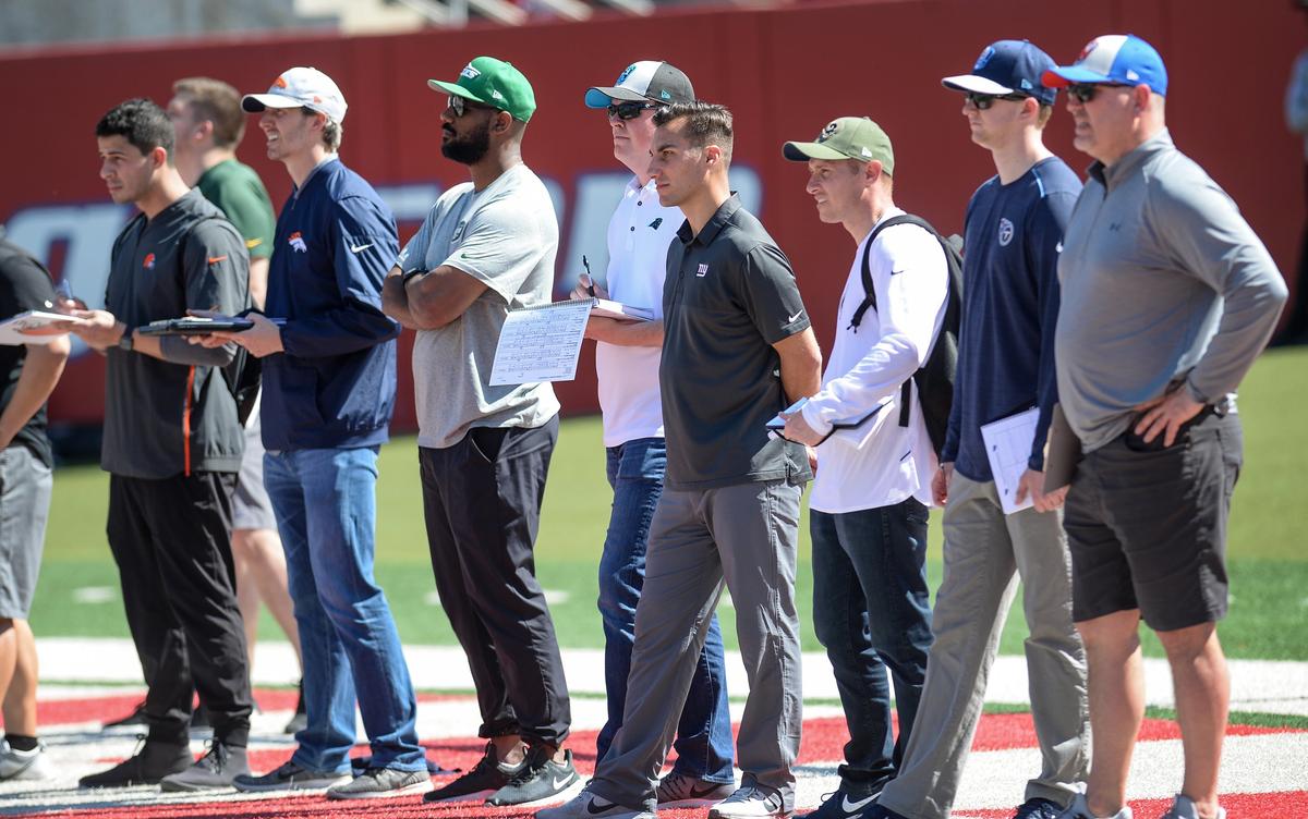 NFL scouts keep watch over players participating in the field evaluation portion of Fresno State football’s Pro Day at Bulldog Stadium on Monday, March 18, 2019.