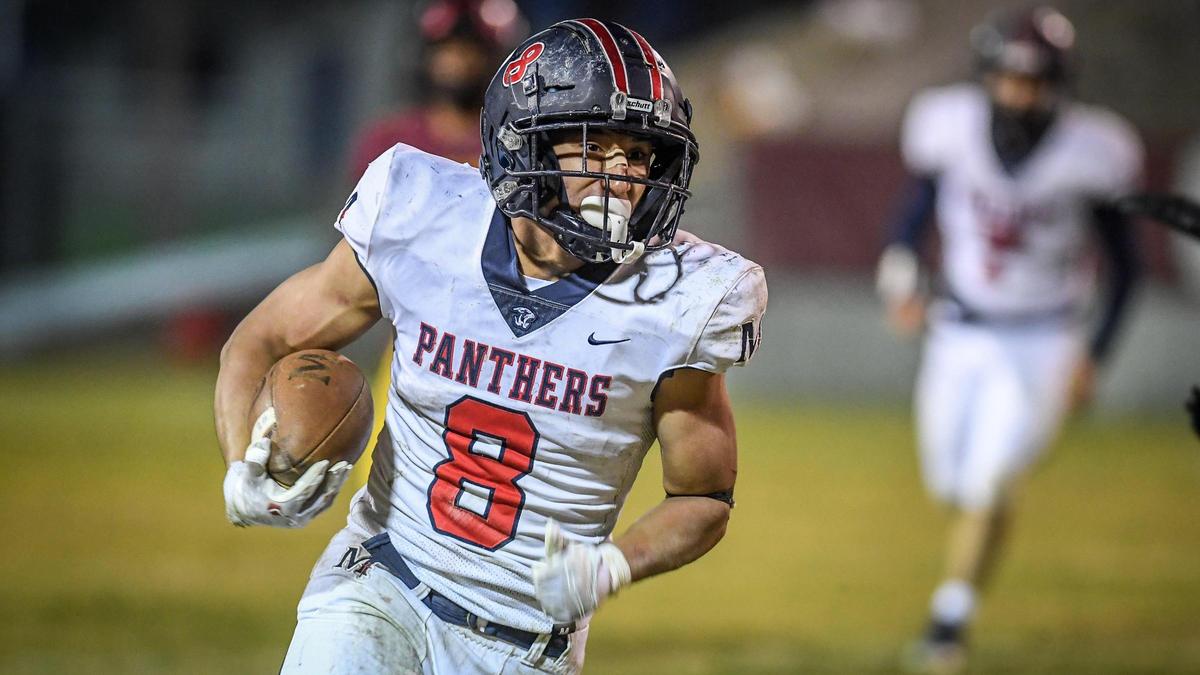 Memorial running back Brandon Ramirez finds a lane down the sideline on a run during their Central Section semifinal playoff game against Clovis West at Lamonica Stadium in Clovis on Friday, Nov. 18, 2022.