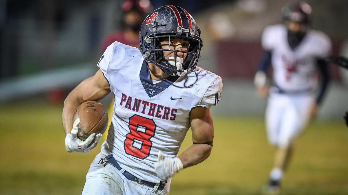 Memorial running back Brandon Ramirez finds a lane down the sideline on a run during their Central Section semifinal playoff game against Clovis West at Lamonica Stadium in Clovis on Friday, Nov. 18, 2022.