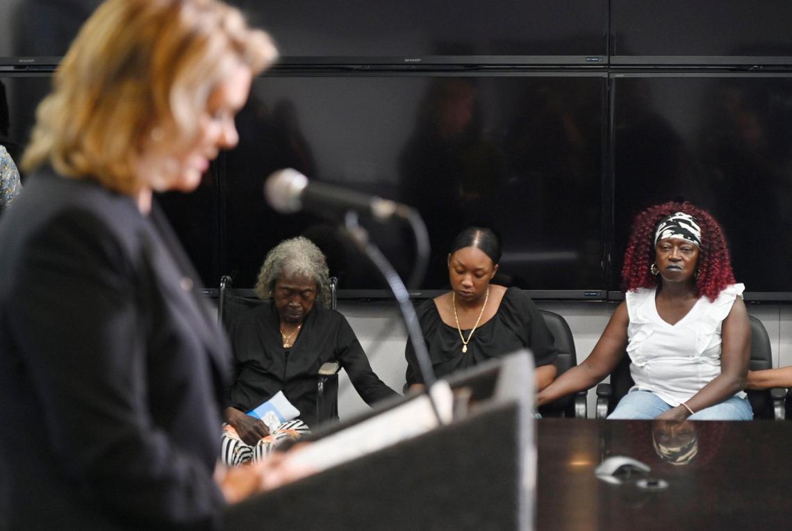 The family of Jacqueline Henry sits against the wal as Fresno County District Attorney Lisa Smittcamp, left, announces the arrest of a suspect after modern DNA methods led to the arrest in the 1987 cold case murder of Jacqueline Henry, during a press conference Tuesday, July 25, 2023 in Fresno.