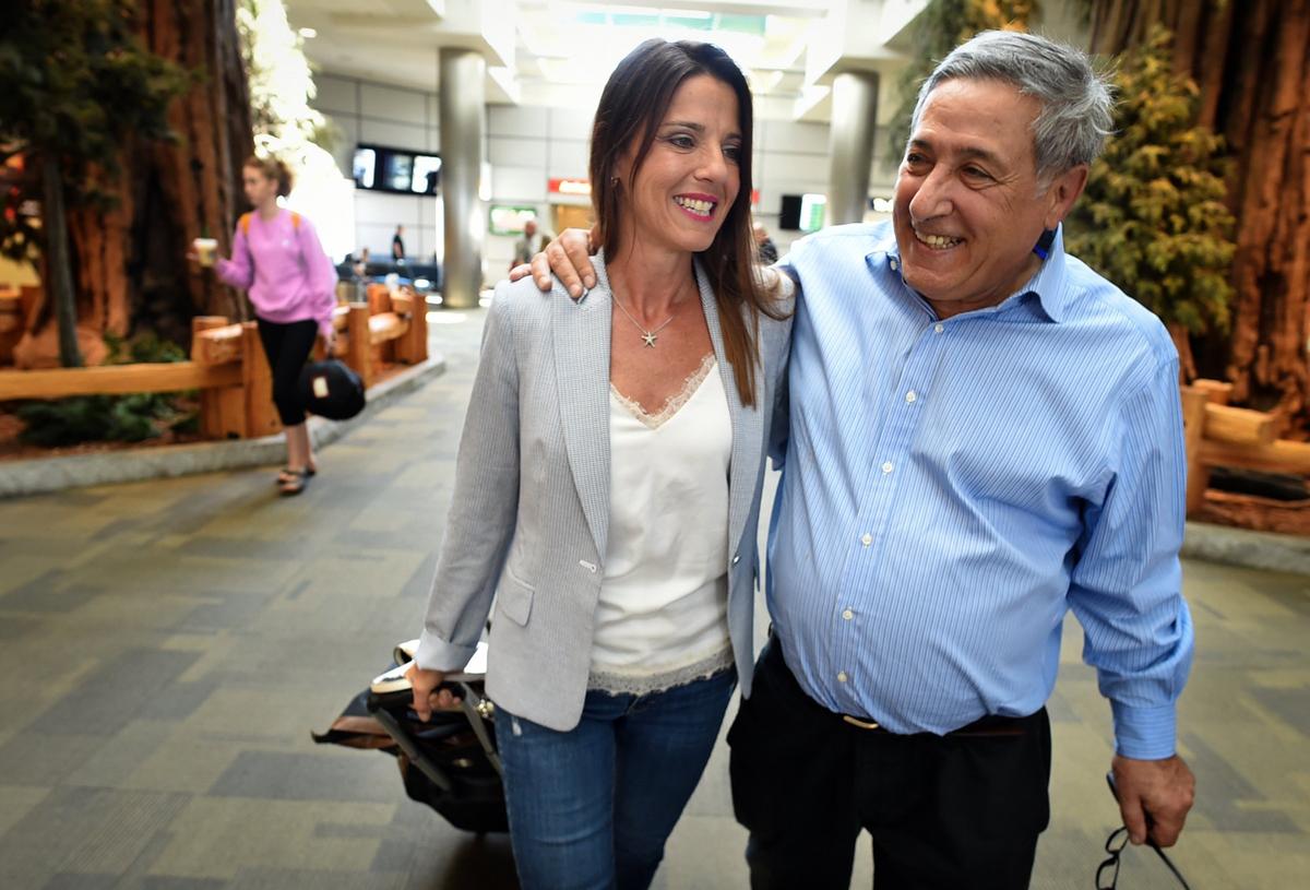 Doug Davidian welcomes his daughter Tiffany Dow after she flew in from Missouri to Fresno Yosemite International Airport, Friday morning, June 15, 2018, for Father's Day weekend.