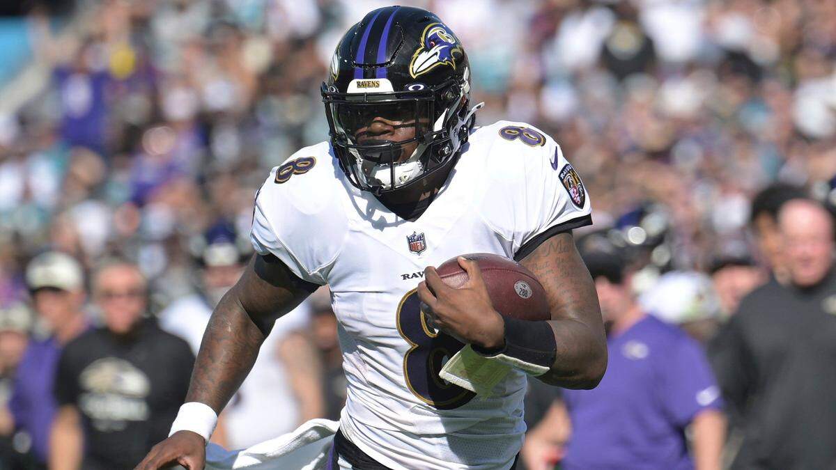 Baltimore Ravens quarterback Lamar Jackson scrambles for yardage during the first half of an NFL game against the Jacksonville Jaguars, Sunday, Nov. 27, 2022, in Jacksonville, Fla.