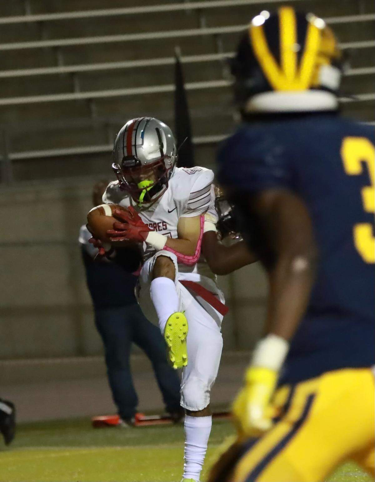 Josiah Salinas of Torres catches a touchdown against Sunnyside on Friday, Oct. 15, 2022.