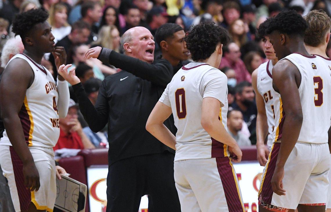 Clovis West head coach Vance Walberg, center, seen during a timeout against San Joaquin Memorial in Open Division action Saturday, Feb. 19, 2022 in Fresno. Clovis West defeated San Joaquin Memorial 83-69.
