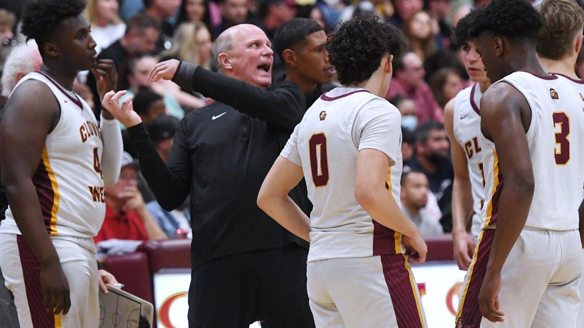 Clovis West head coach Vance Walberg, center, seen during a timeout against San Joaquin Memorial in Open Division action Saturday, Feb. 19, 2022 in Fresno. Clovis West defeated San Joaquin Memorial 83-69.