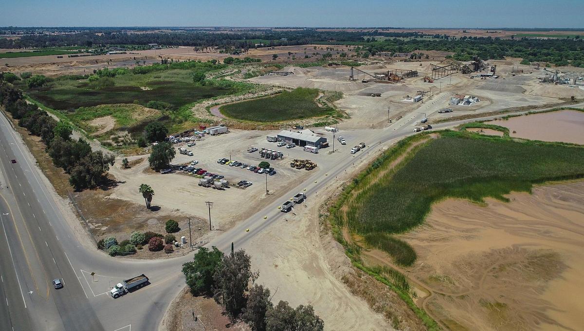 The entrance to the CEMEX Rockfield aggregate plant site in Friant is seen in this drone image on Wednesday, June 17, 2020. The company applied to Fresno County to continue mining the quarry for 100 years, and use blasting and drilling to mine a 600-ft deep pit.