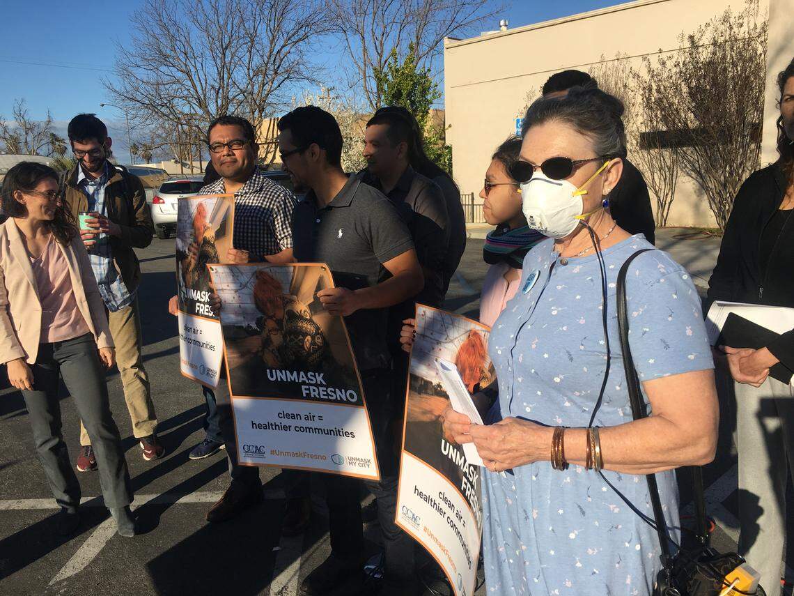 Janet DietzKamei, right, a retired government employee and Central Valley Air Quality Coalition member, attends a news conference outside a Boys & Girls Club in southeast Fresno on March 13, 2019 announcing a new doctor-led campaign for clean air, Unmask Fresno.