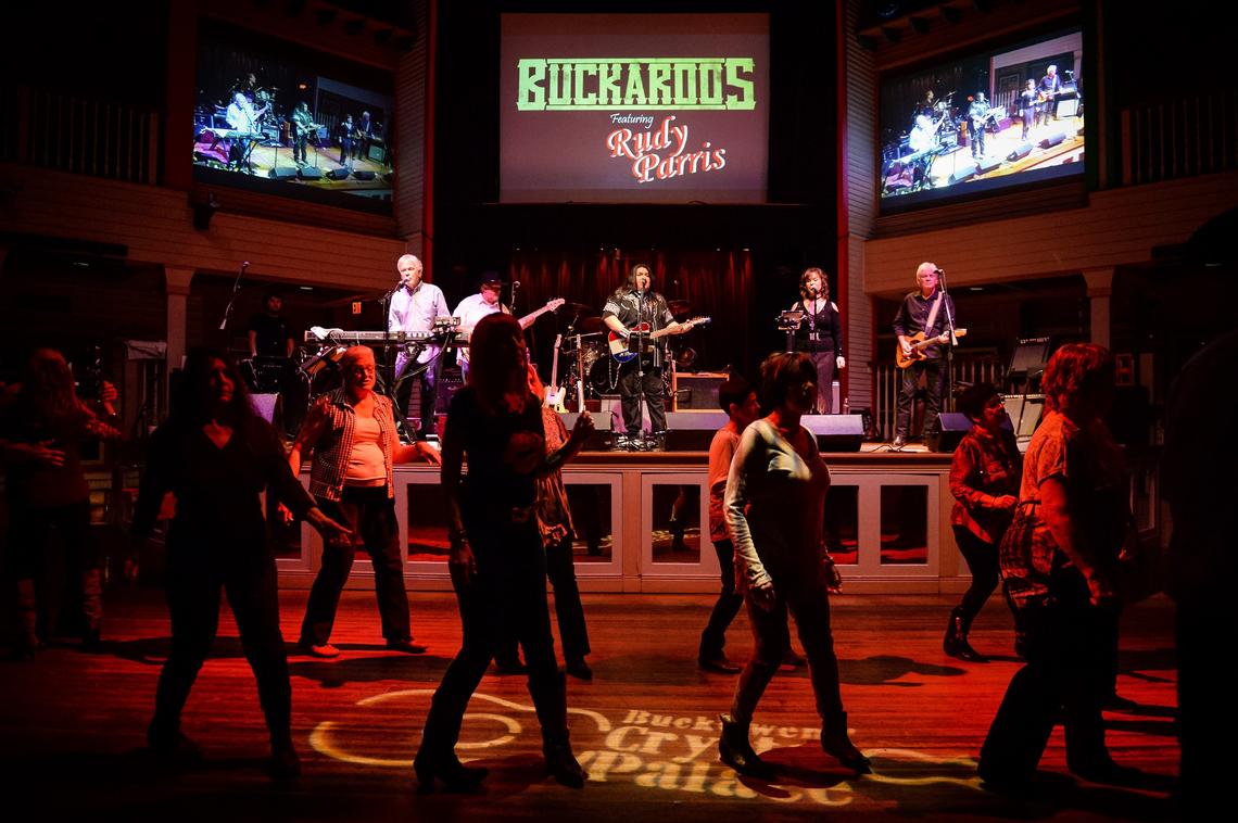 Audience members line dance as Rudy Parris, center, performs his first show as featured artist with the Buckaroos at the Buck Owen’s Crystal Palace in Bakersfield on Friday, March 1, 2019