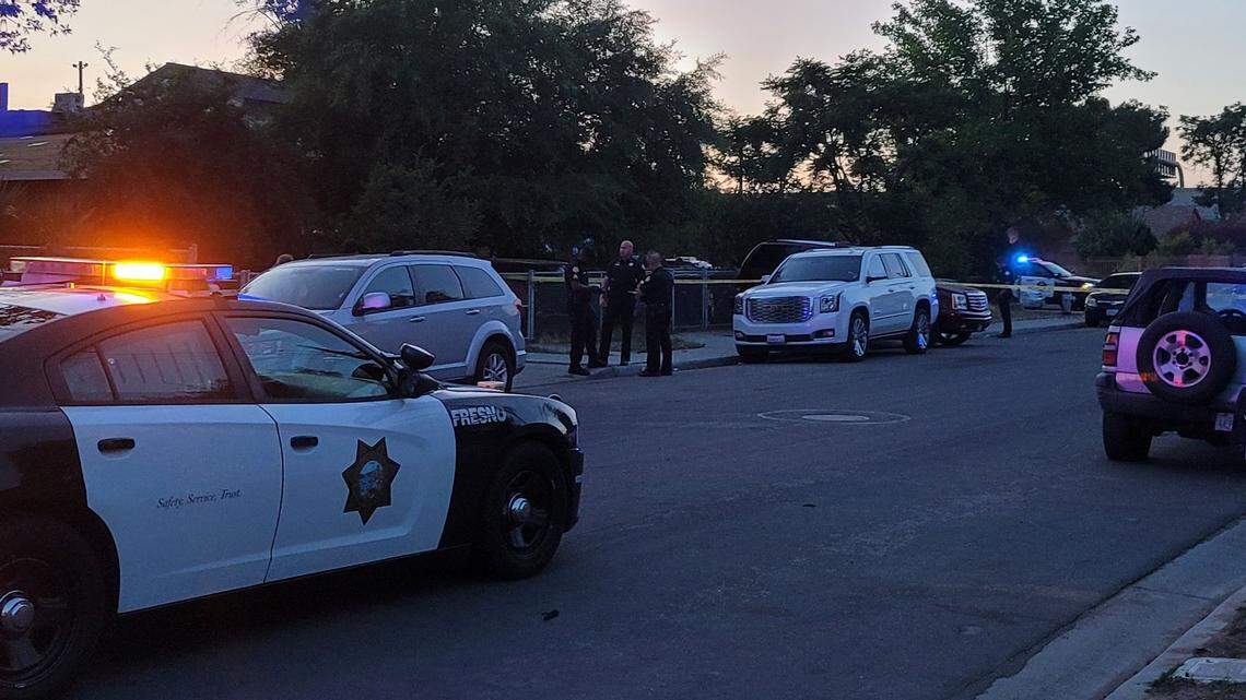 Police tape off a southeast Fresno neighborhood to investigate a shooting at a home on Bond Street and Thomas Avenue on Monday, May 2, 2022.