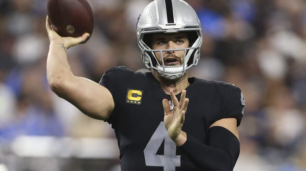 Las Vegas Raiders quarterback Derek Carr throws against the Los Angeles Chargers during the first half of an NFL game, Sunday, Jan. 9, 2022, in Las Vegas.