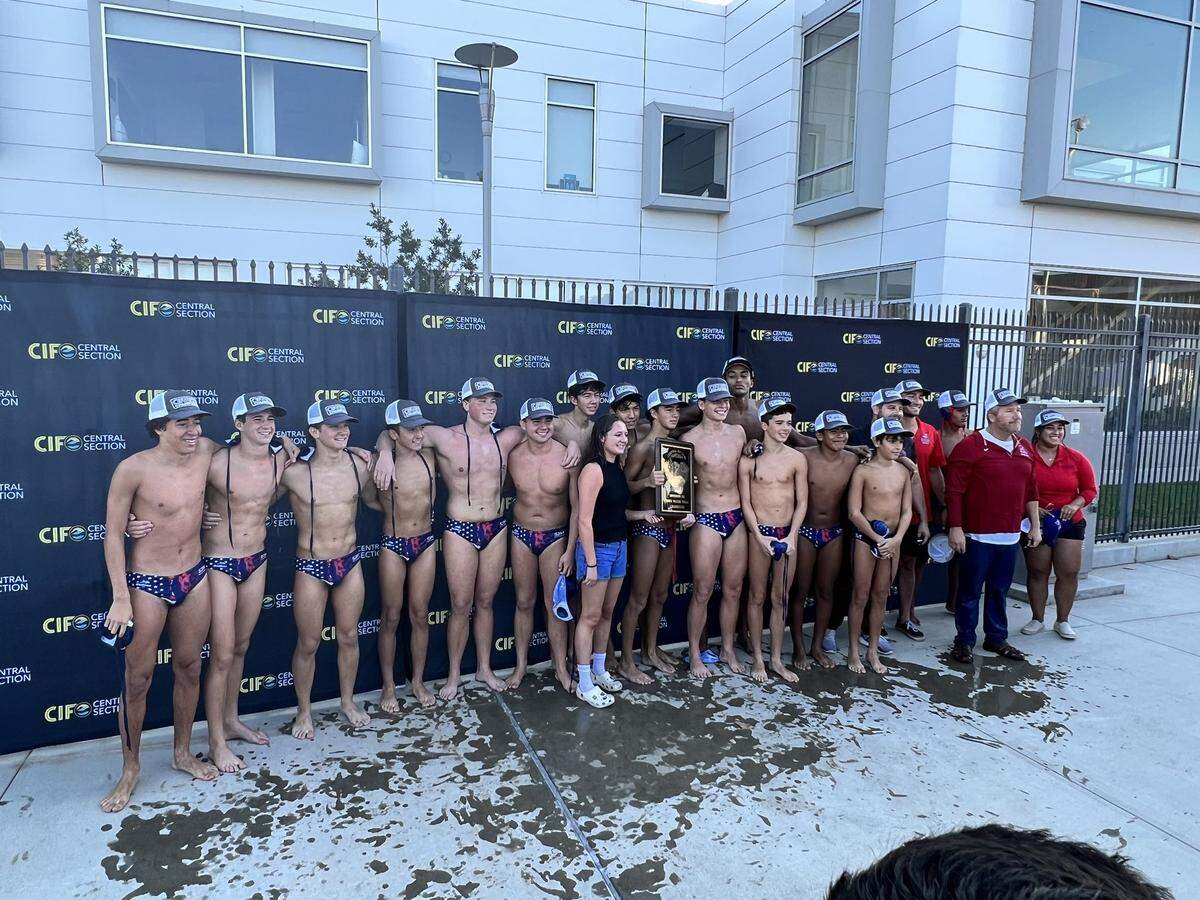The San Joaquin Memorial boys water polo team poses for a photo after a Central Section Division II championship on Saturday, Nov. 11, 2023.