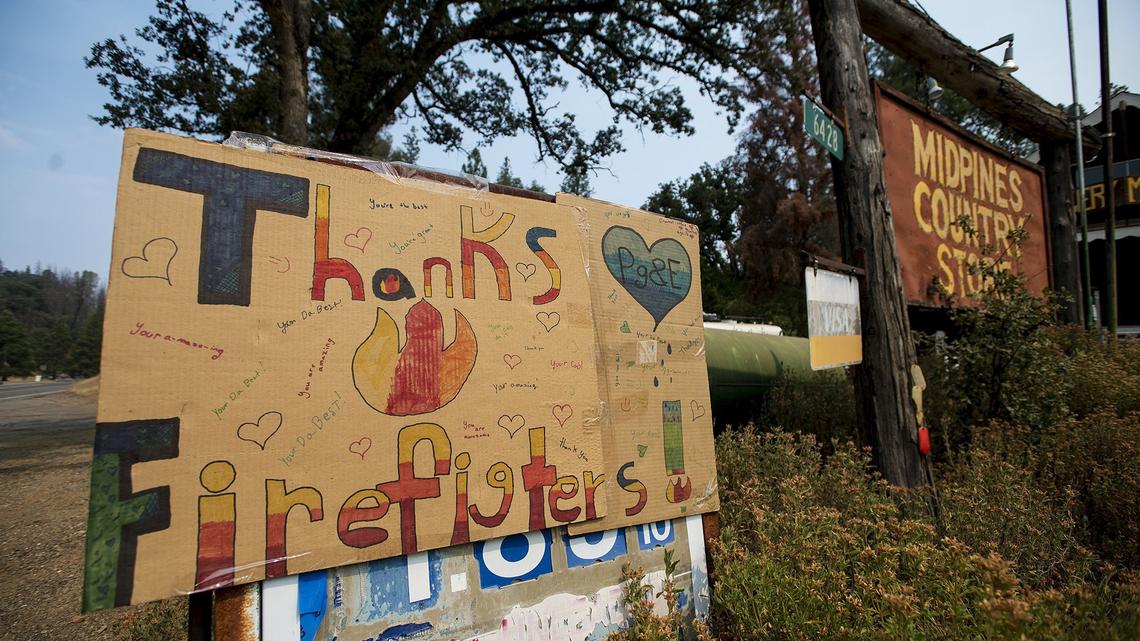 A sign thanking firefighters battling the Ferguson Fire, is displayed in front of the Midpines Country Store along Highway 140 in Midpines, Calif., on Saturday, July 21, 2018. According to the California Department of Forestry and Fire Protection, the Ferguson Fire burning in Mariposa County, has burned more than 27,000 acres and is seven percent contained.