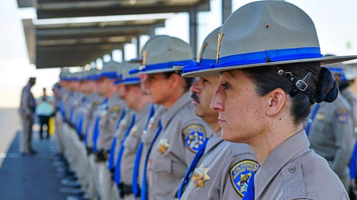 Officers stand at attention during a CHP uniform inspection in Fresno earlier this year.