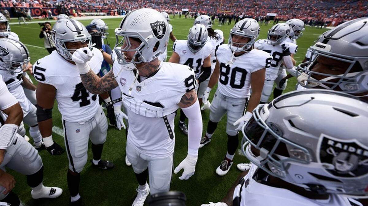 Maxx Crosby talks to his Las Vegas Raiders teammates before the NFL game against the Denver Broncos on Sept. 10, 2023.
