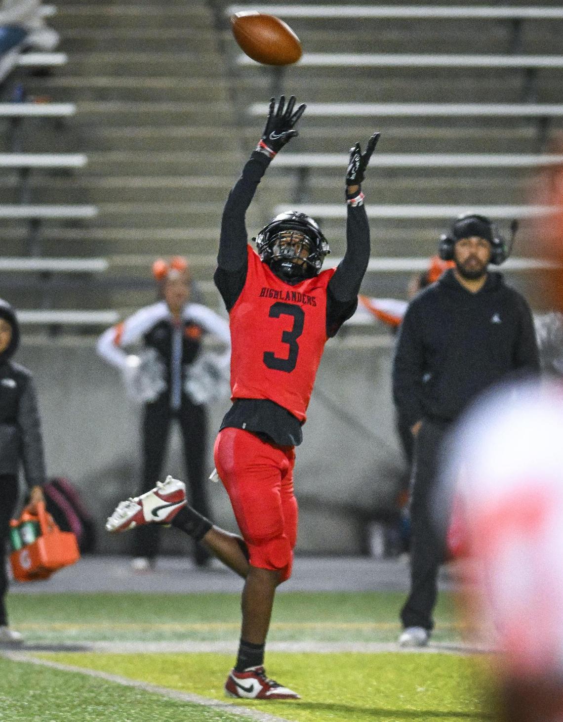 McLane wide receiver Julyen Scott reaches up for the ball on a long pass down the sideline before taking it into the end zone for a touchdown against Wasco in the second half of their Central Section Division IV quarterfinal playoff game at McLane Stadium in Fresno on Friday, Nov. 8, 2024.