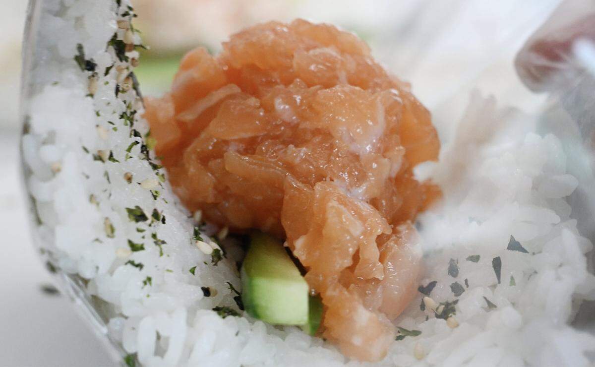 A salmon handroll is created the new Poke House located at The Avenue at Heritage Grove, Wednesday, May 20, 2026 in Clovis.