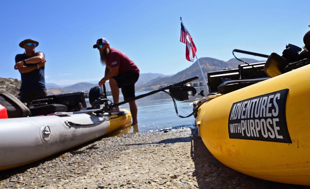 Adventures With Purpose lead diver Nick “Rattlesnake” Rinn, left, and team leader Doug Bishop, right, prepare to launch to begin their search for Jolissa Fuentes at Pine Flat Lake’s Deer Creek marina Friday morning, Aug. 26, 2022 in Fresno. The team search Avocado Lake on Thursday.
