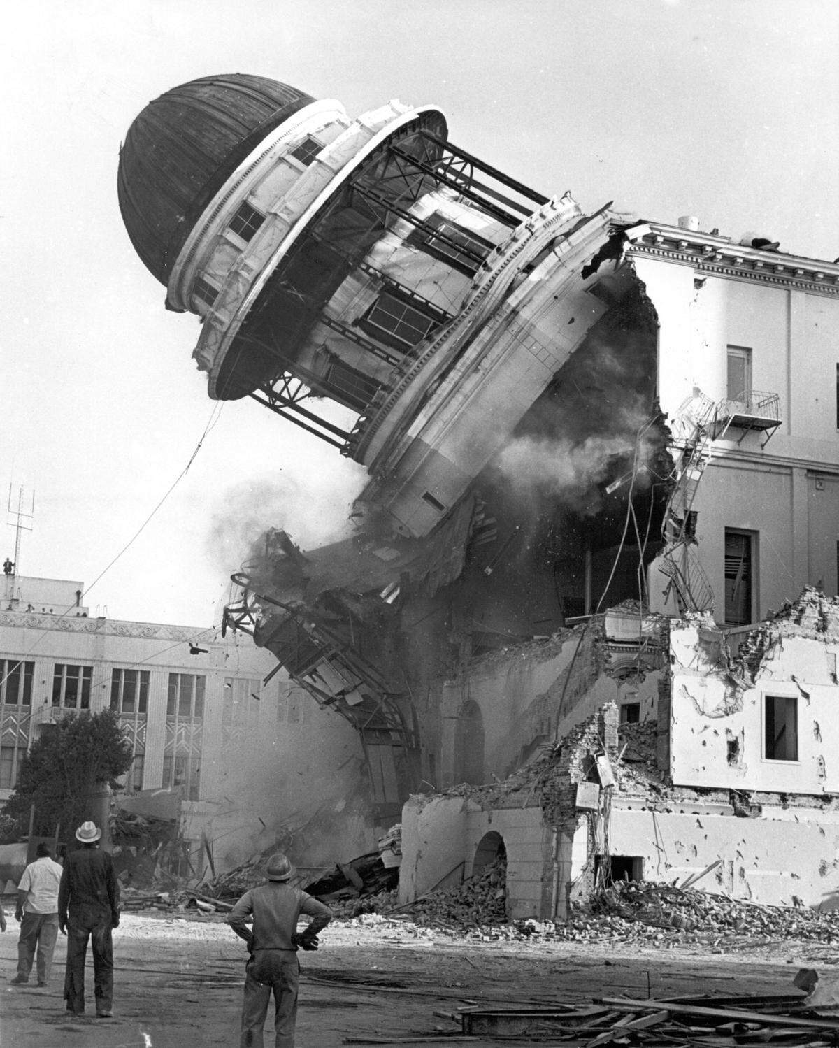 The old Fresno County Courthouse was razed in 1966. Photographer Carl Crawford used two motorized cameras trained on the target. One he held and the other, on a tripod, was fired off by Bee reporter Eli Setencich.